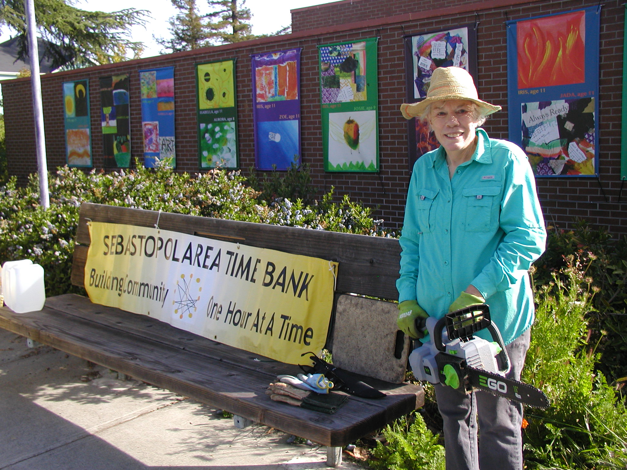 4/5: Time Bank volunteers clean up the gardens around the library and city hall